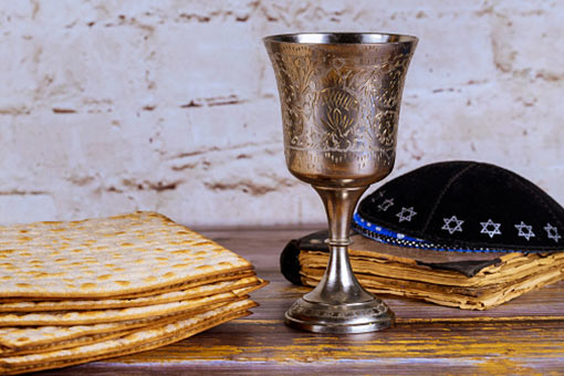 Matzoh, a kiddish cup, and an yarmulke